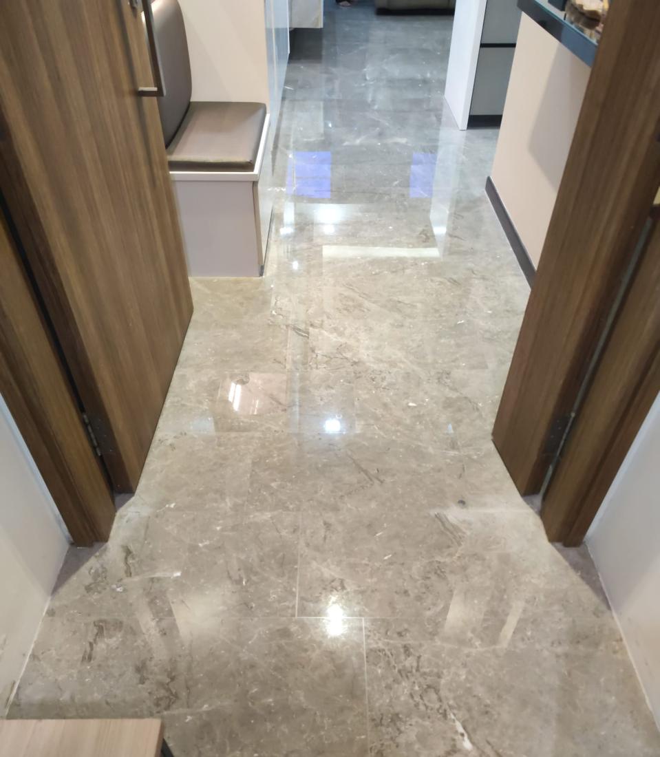 Grey marble corridor floor after polishing