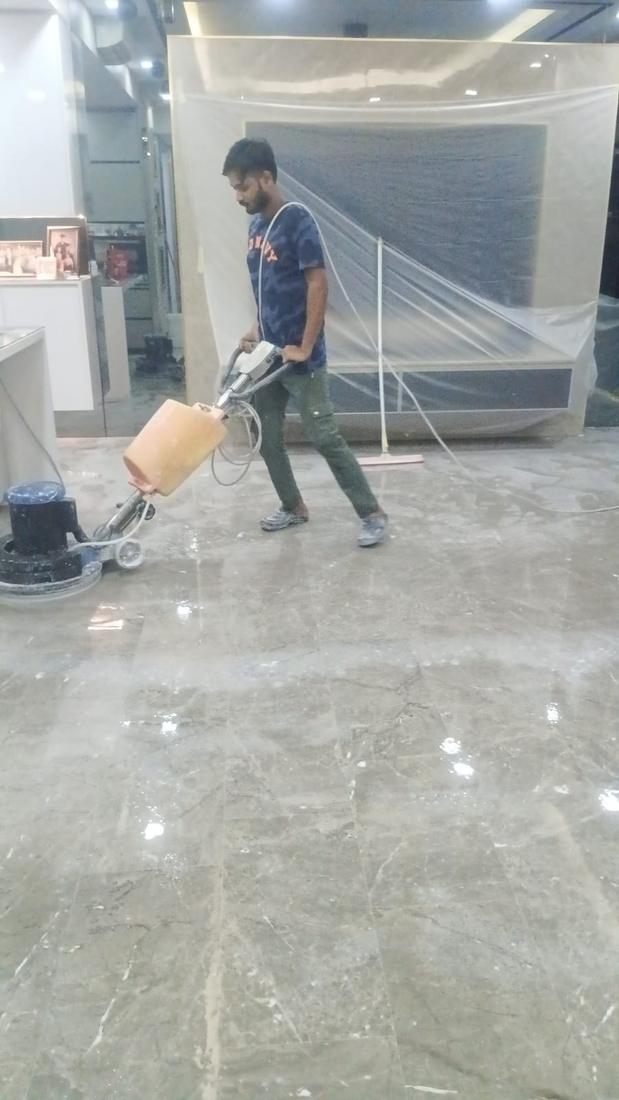 Crystallisation polishing with the TV wall wrapped in plastic