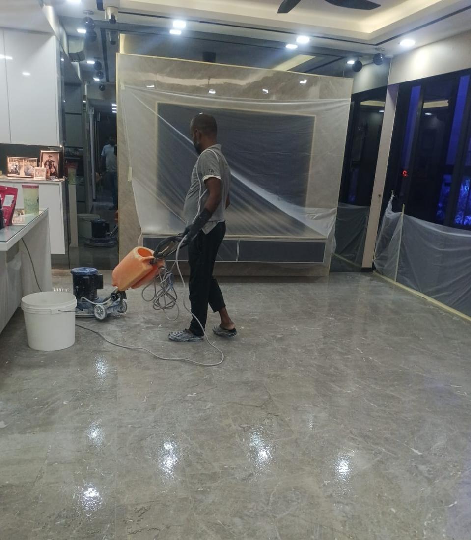 Marble polishing with furniture covered in plastic sheets