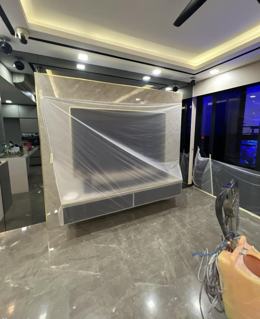 TV console wrapped in plastic before marble polishing